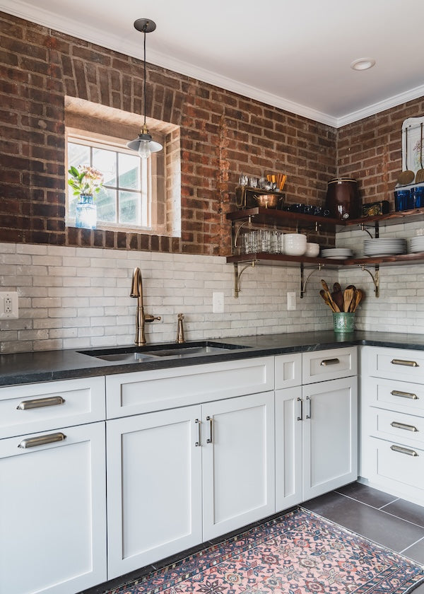White subway tile with exposed brick in a Berlin CT kitchen